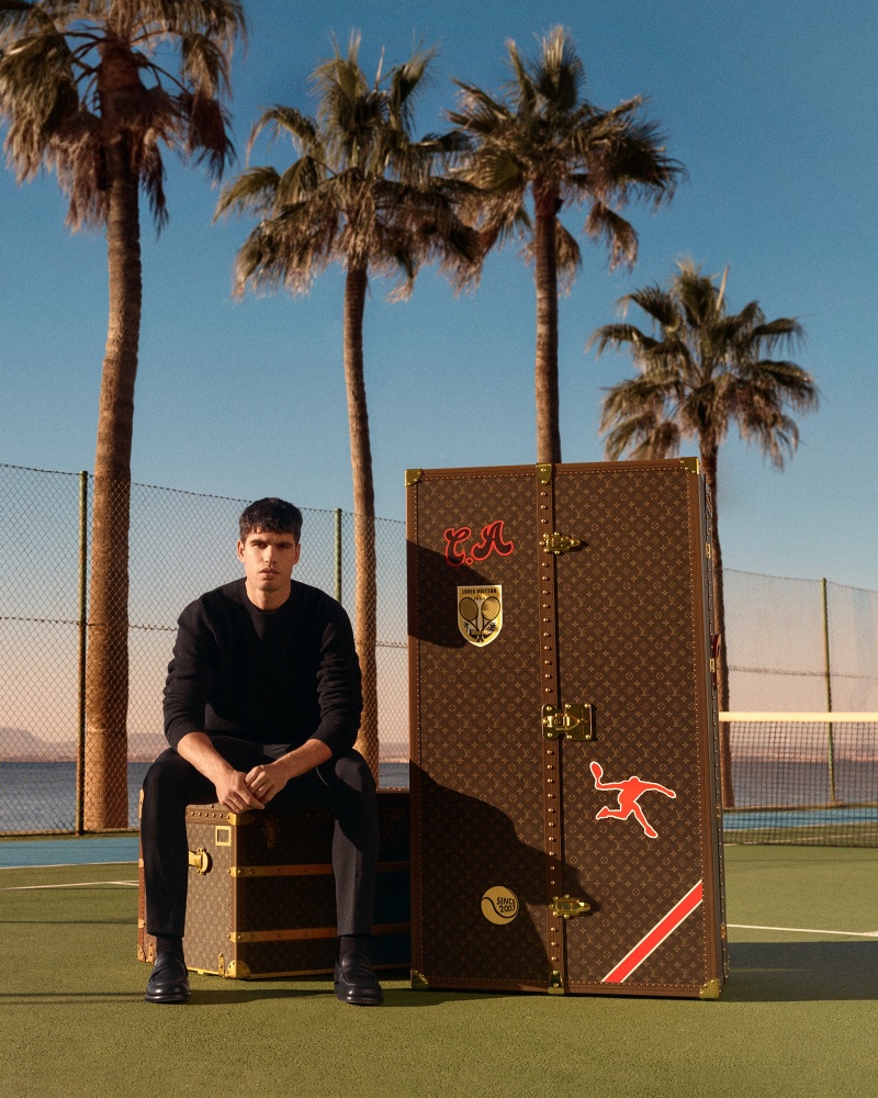 Carlos Alcaraz alongside his Louis Vuitton Malle Vestiaire, the personalized trunk symbolizing a blend of sports excellence and luxury. 