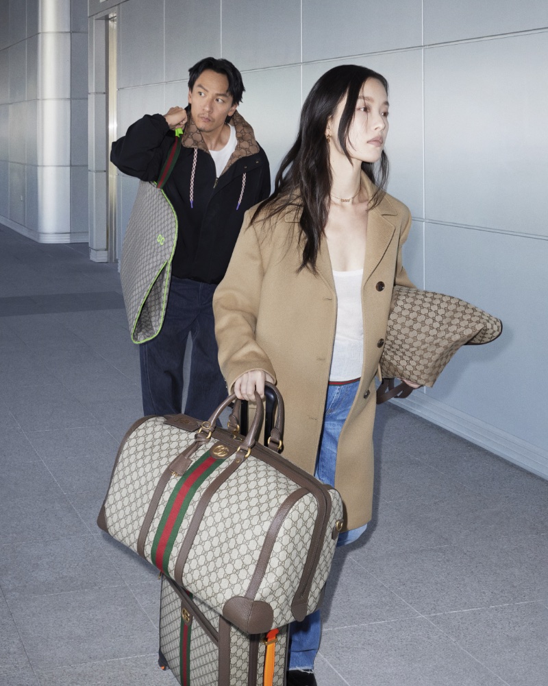 Ni Ni and Chang Chen, stride through the airport in Gucci Valigeria's 2024 advertisement.