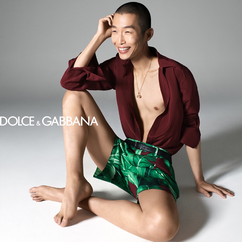 Xu Meen dazzles in Dolce & Gabbana's resort collection, pairing a deep burgundy shirt with tropical shorts.