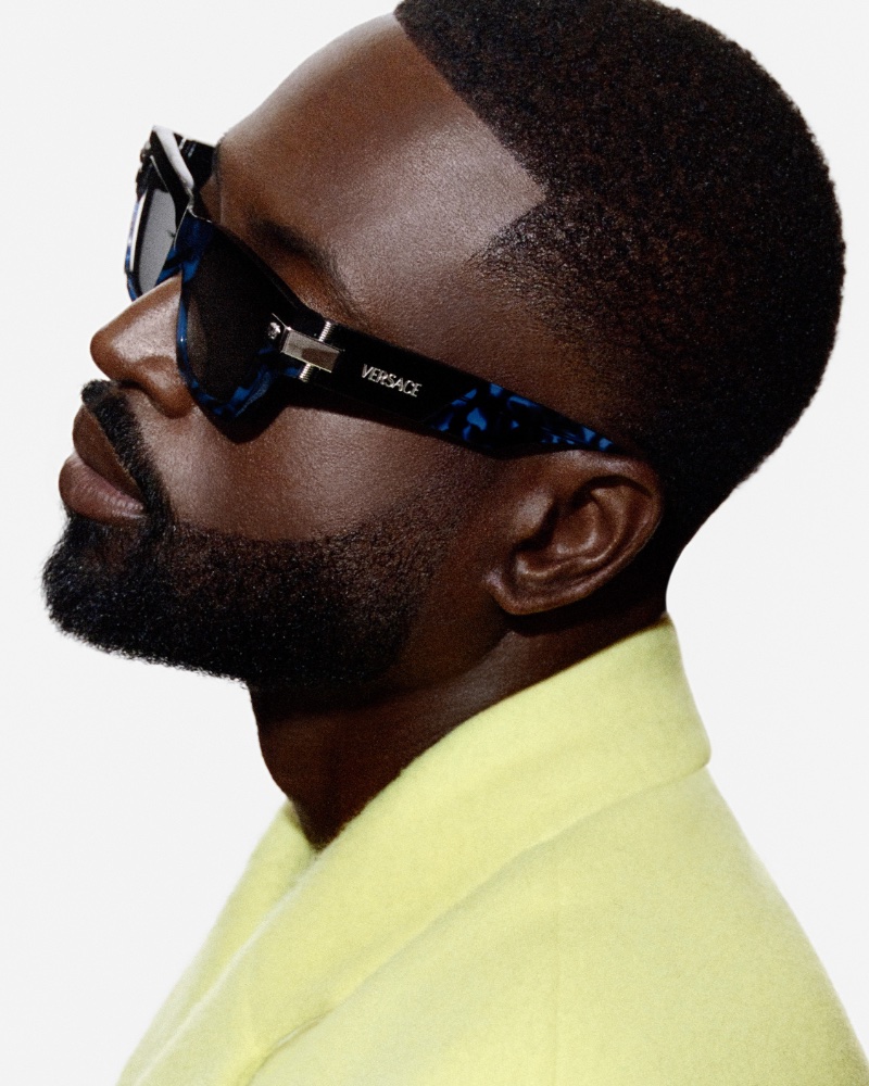The Versace eyewear ad gets a vibrant twist with Dwyane Wade in a neon highlight.