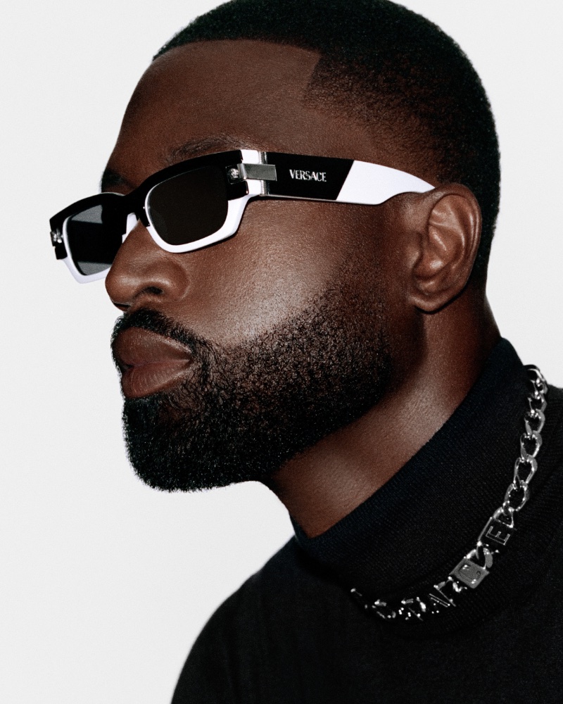 Versace's eyewear campaign shines with Dwyane Wade, featuring the iconic logo on sleek black frames.