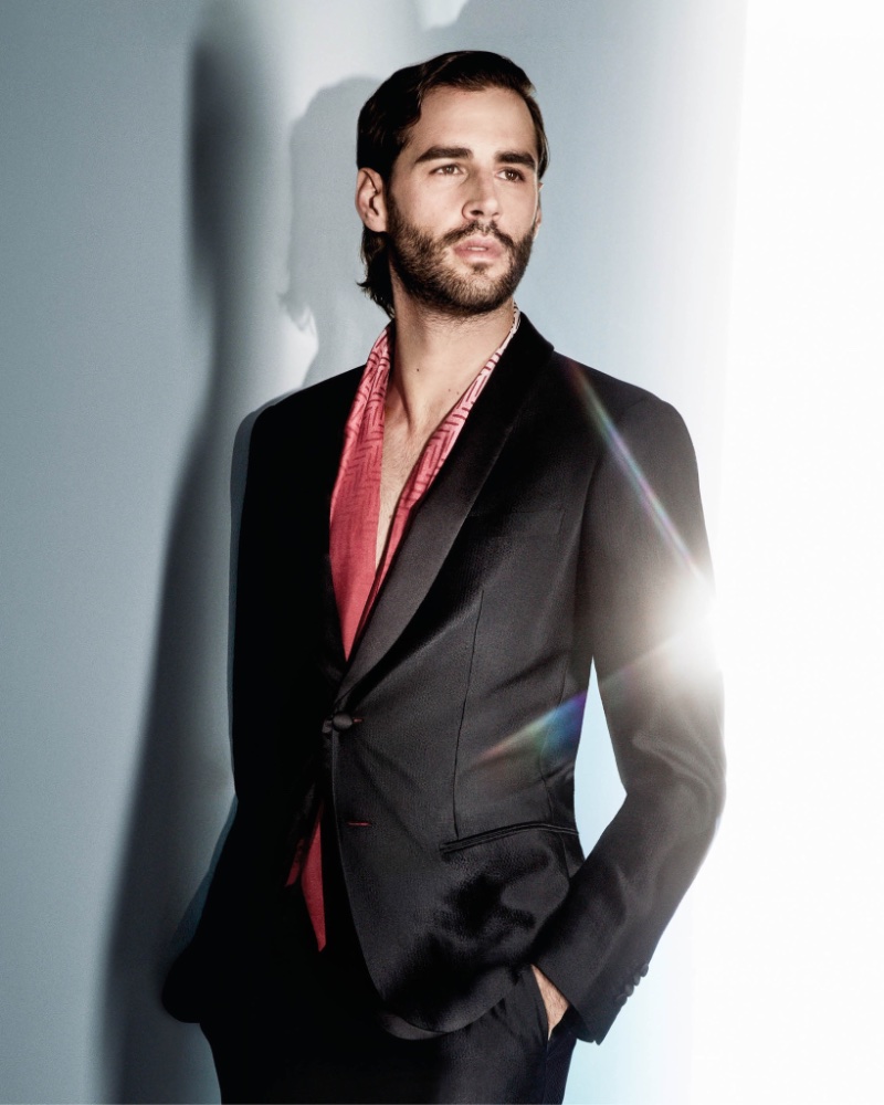 Giorgio Armani's spring-summer 2024 campaign features Gianmarco Tamberi, exuding sophistication in a tailored black suit.