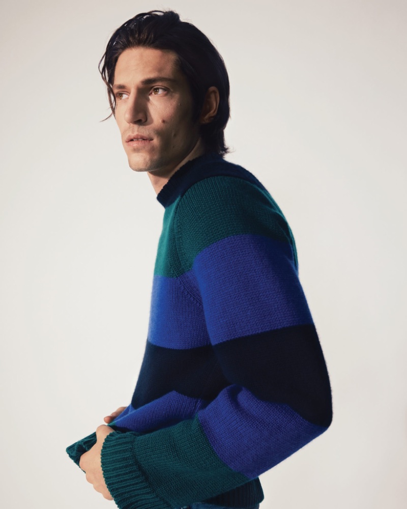 Posing for Holt Renfrew, Justin Eric Martin wears a Guest in Residence striped cashmere sweater. 