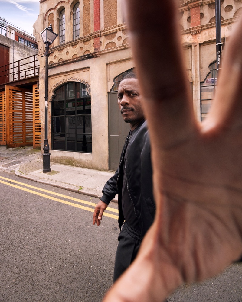 On the move, Idris Elba sports a recycled satin iconic bomber jacket for Calvin Klein's ad.