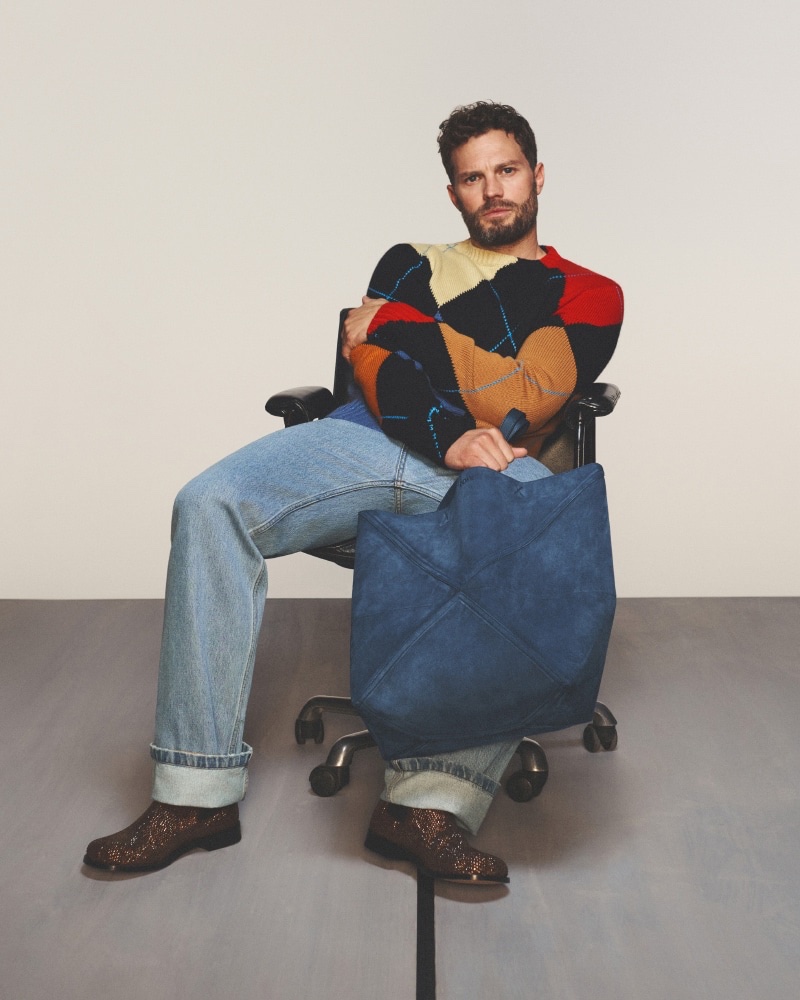 Jamie Dornan, poised and stylish, showcases LOEWE's vibrant knitwear for spring-summer 2024.