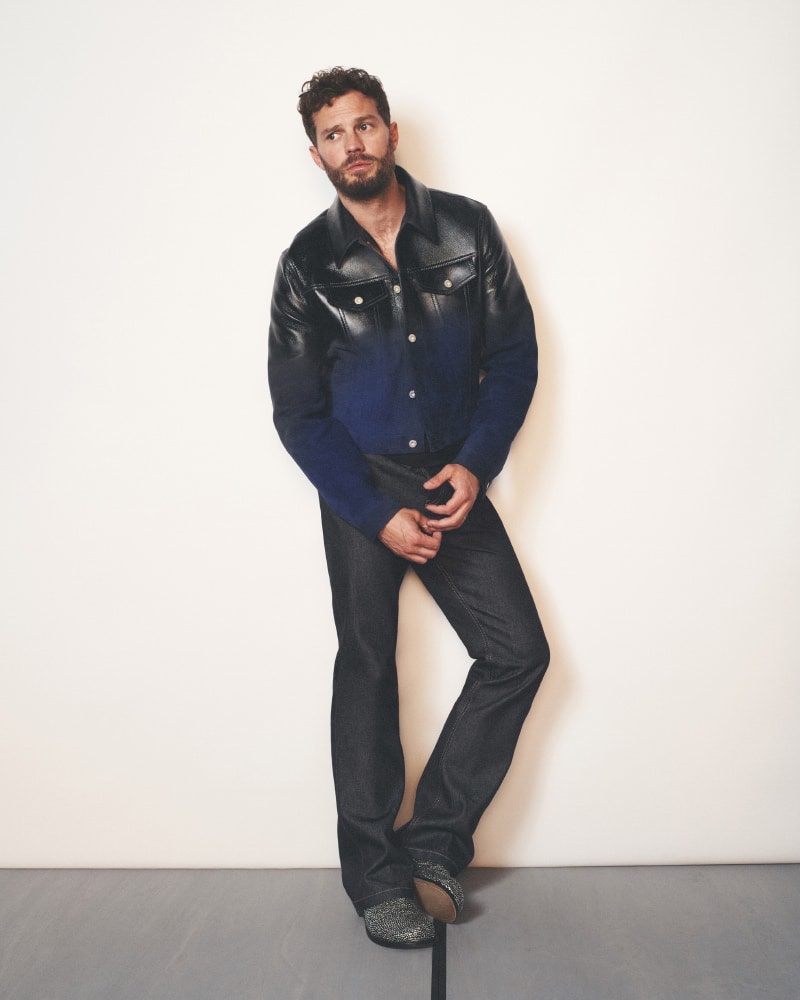 Exuding casual elegance, Jamie Dornan models a denim ensemble in LOEWE's spring-summer 2024 ad.