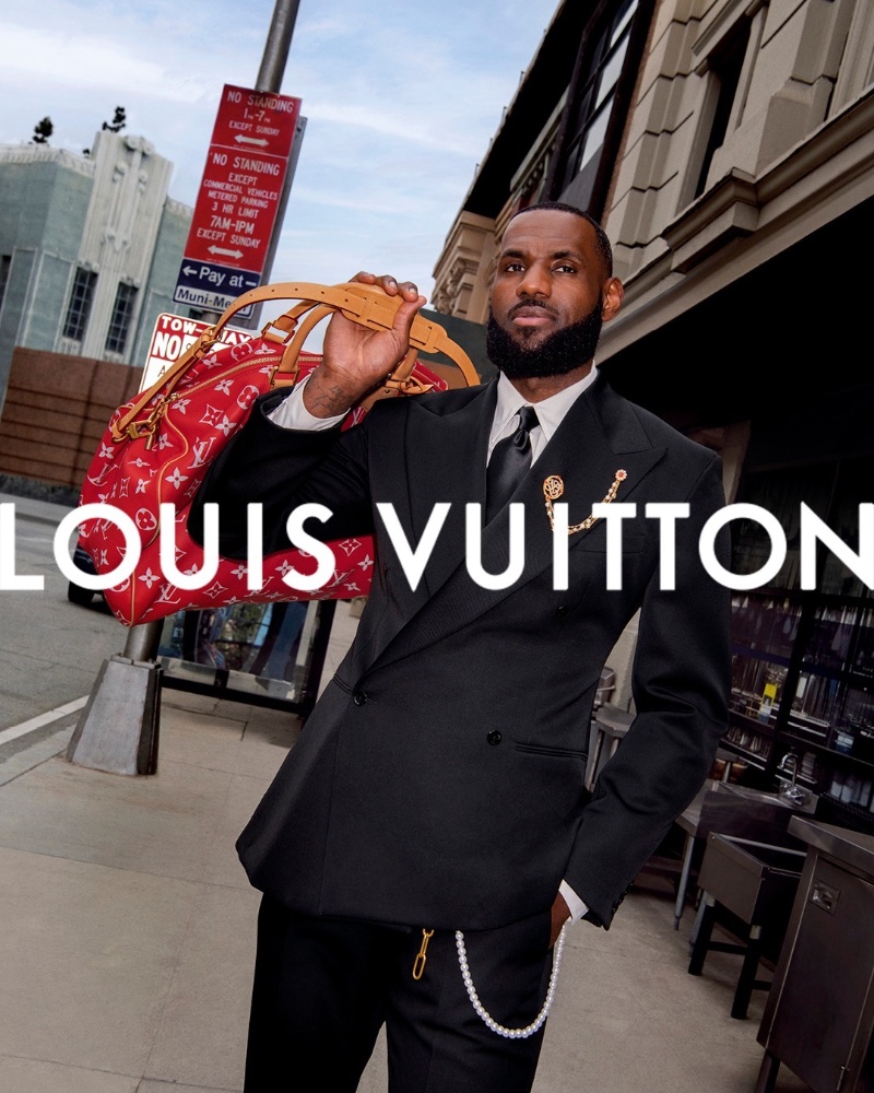 LeBron James wears a sleek double-breasted suit for Louis Vuitton's spring 2024 advertisement.