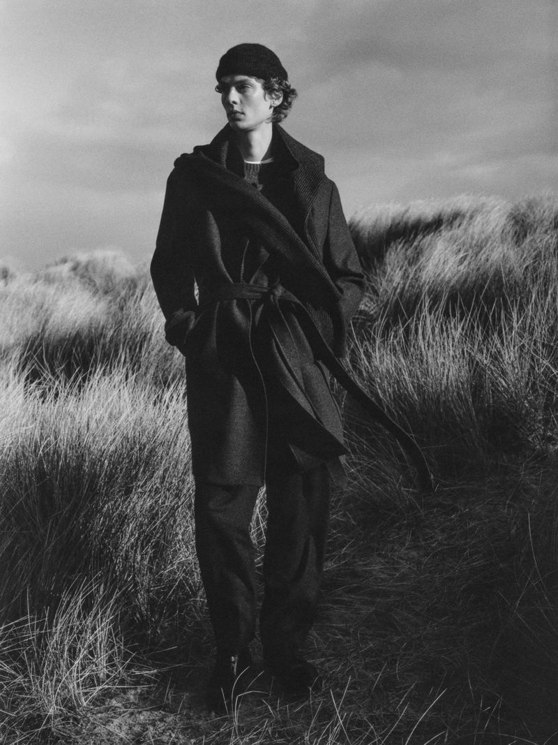 Leon Dame dons a belted Massimo Dutti coat. 
