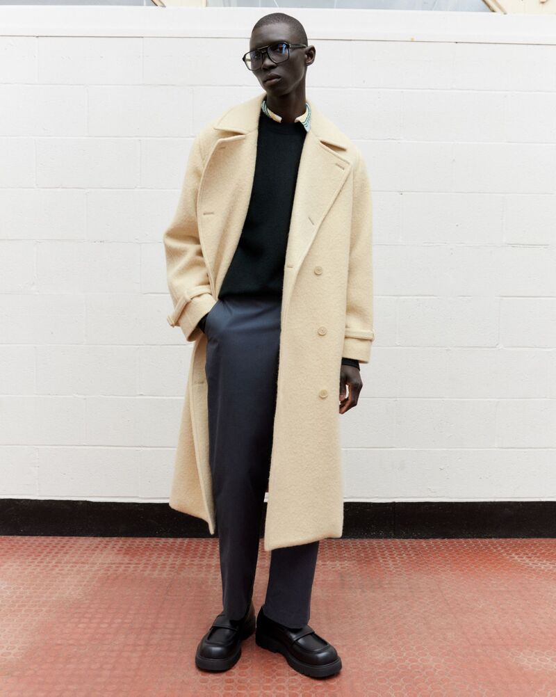 Fernando Cabral wears an Auralee trench coat from Matches. 