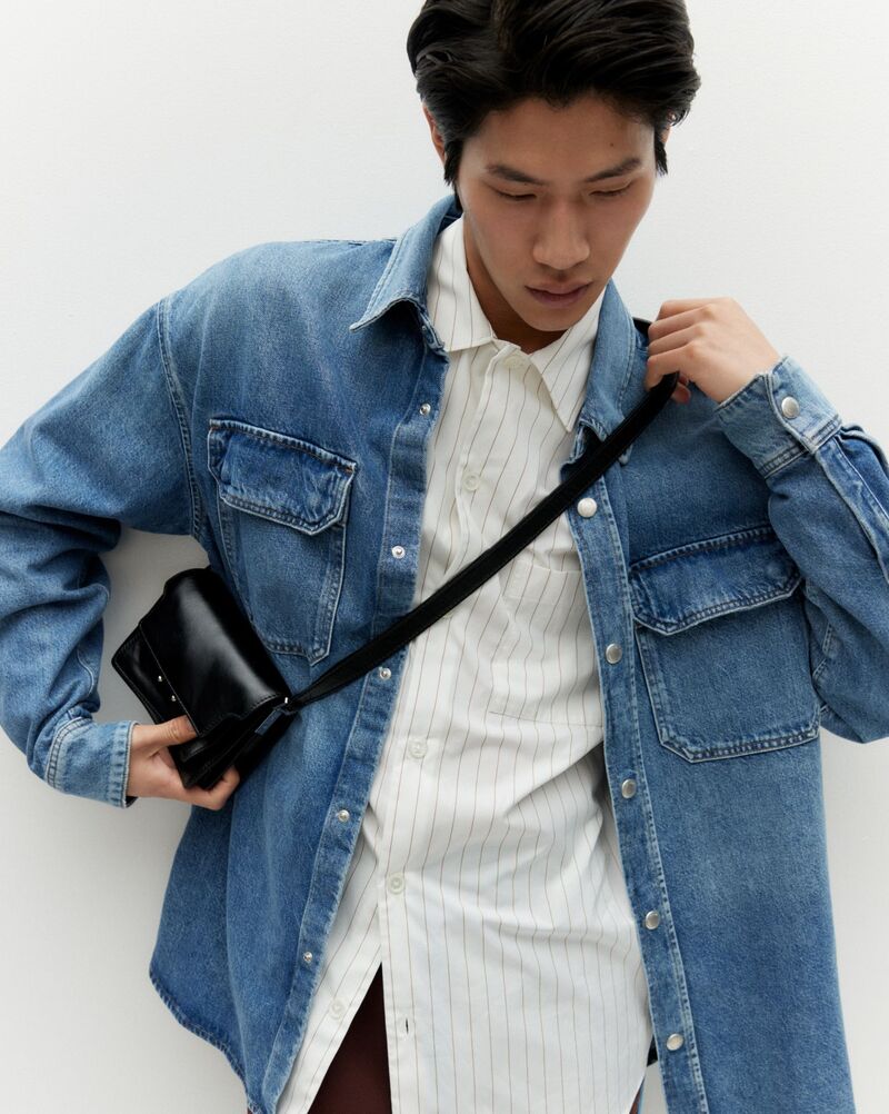 Model Sanggun Lee rocks a denim shirt by Agolde for Matches.