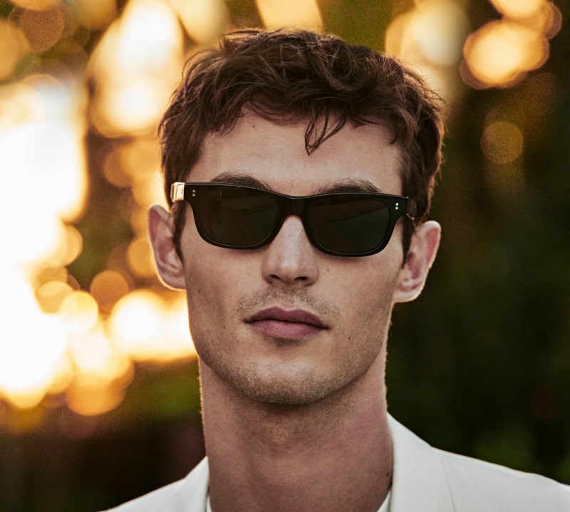 Amidst the golden hour glow, Kit Butler wears Rosson Sun sunglasses for Oliver Peoples' spring 2024 campaign.