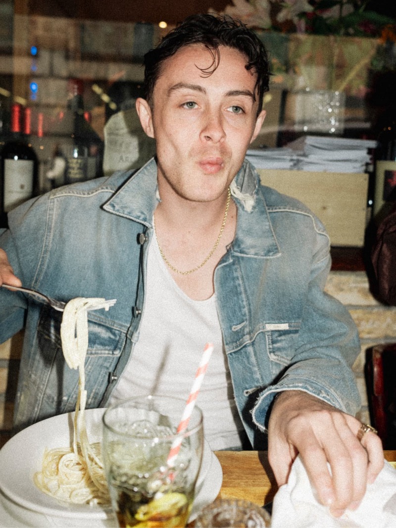 Sonny Hall captures the essence of laid-back style with Closed's denim jacket while enjoying a casual dine-out.