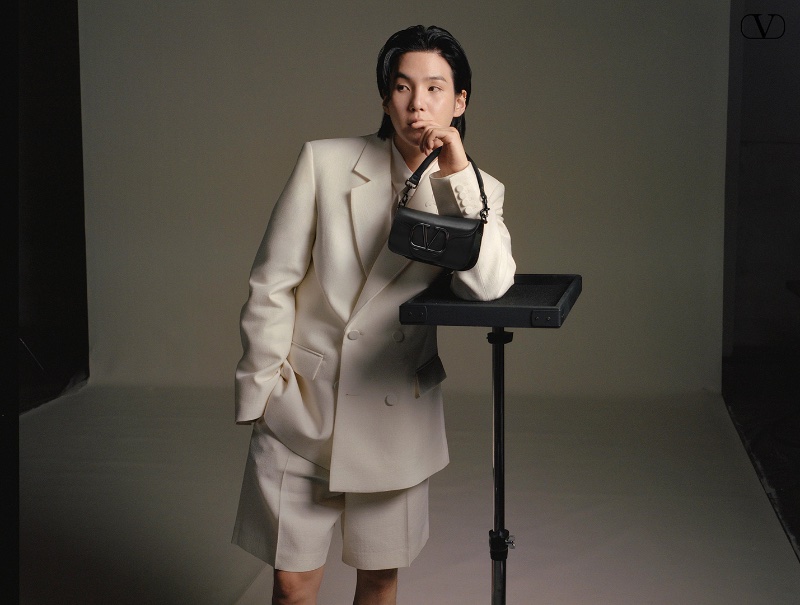 Suga appears in The Narratives spring-summer 2024 campaign, donning a Valentino short suit. 