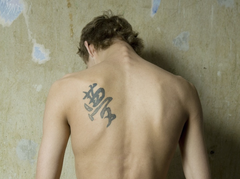 Symbolic Insignia Back Tattoo