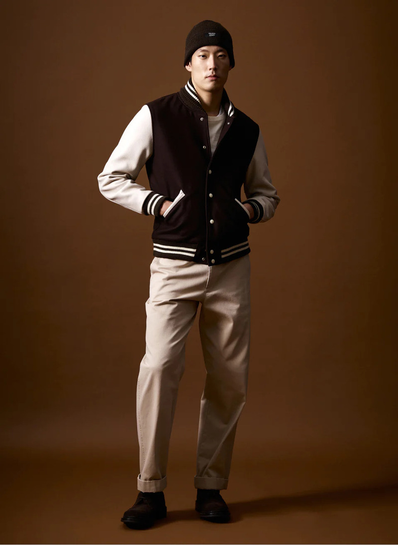 Juhyung Kang wears a Todd Snyder x Denhen varsity leather jacket.