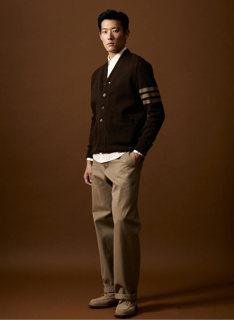 In front and center, Juhyung Kang wears a Todd Snyder x Denhen classic cardigan. 