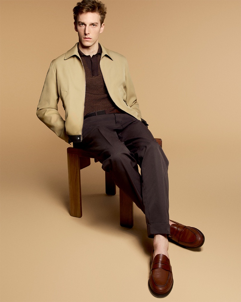 Quentin Demeester fronts Tod's pre-spring 2024 campaign, donning a sleek beige jacket, knit polo and loafers.