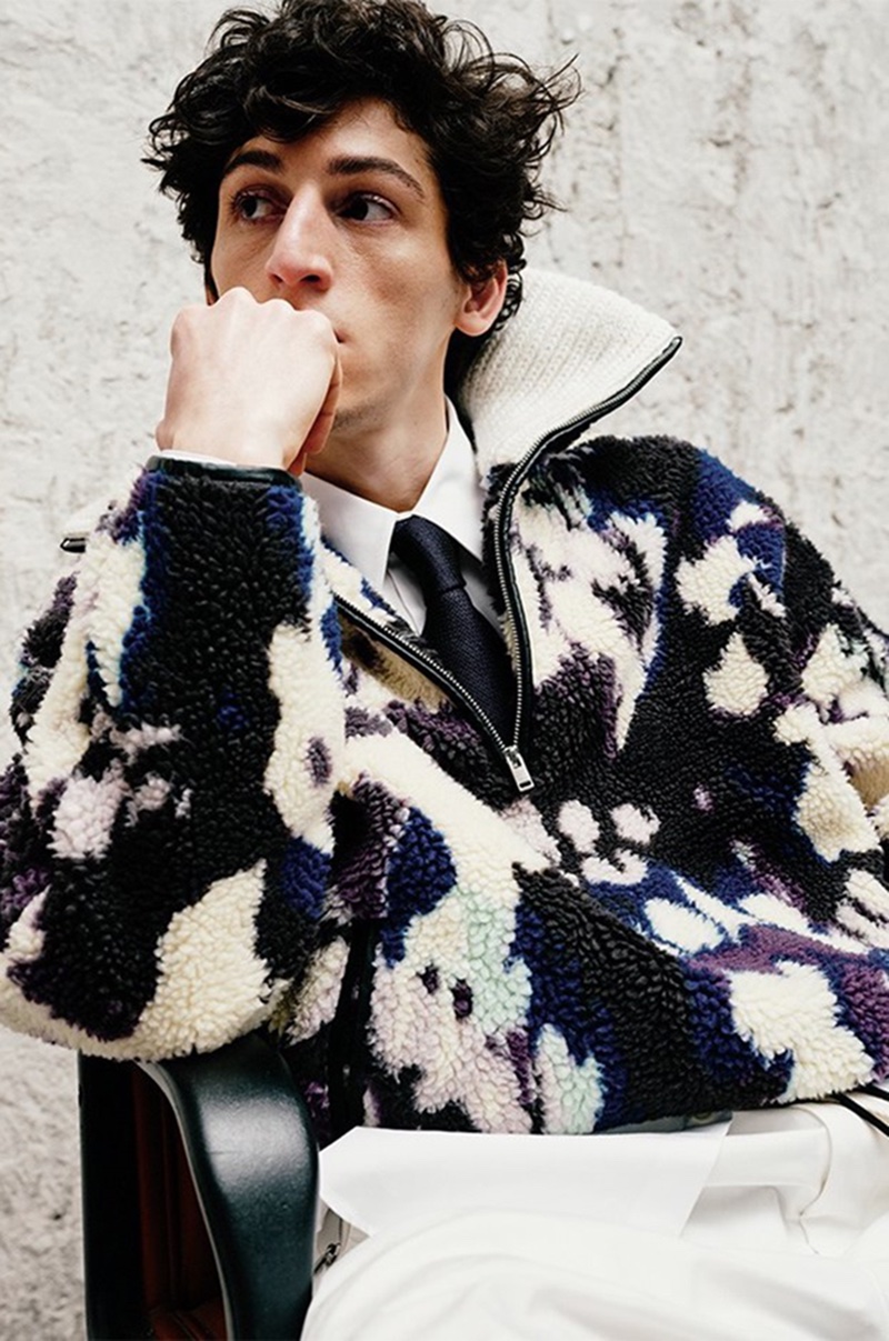 Model Aslan Tsallatii makes a printed statement for LuisaViaRoma in a 3/4 pullover by Isabel Marant.