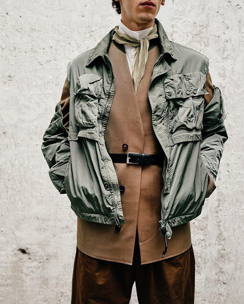 C.P. Company utility jacket with a Maison Margiela wool jacket, Lemaire trousers, and a Maison Margiela leather belt.
