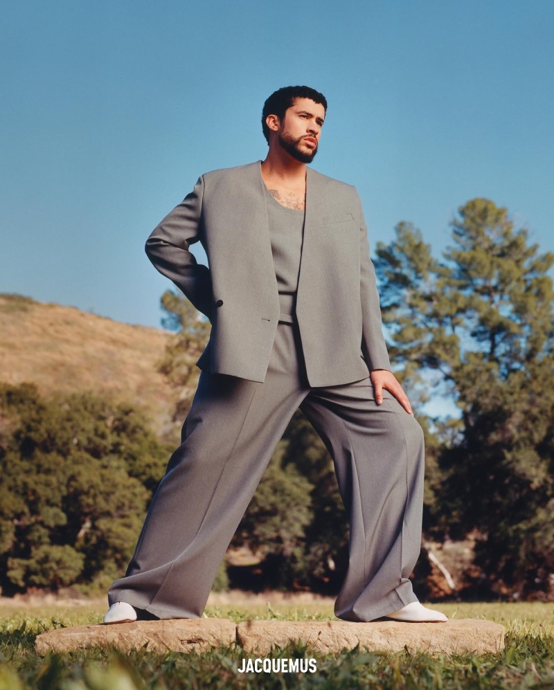 Exuding confidence, Bad Bunny presents a JACQUEMUS grey suit for spring-summer 2024.