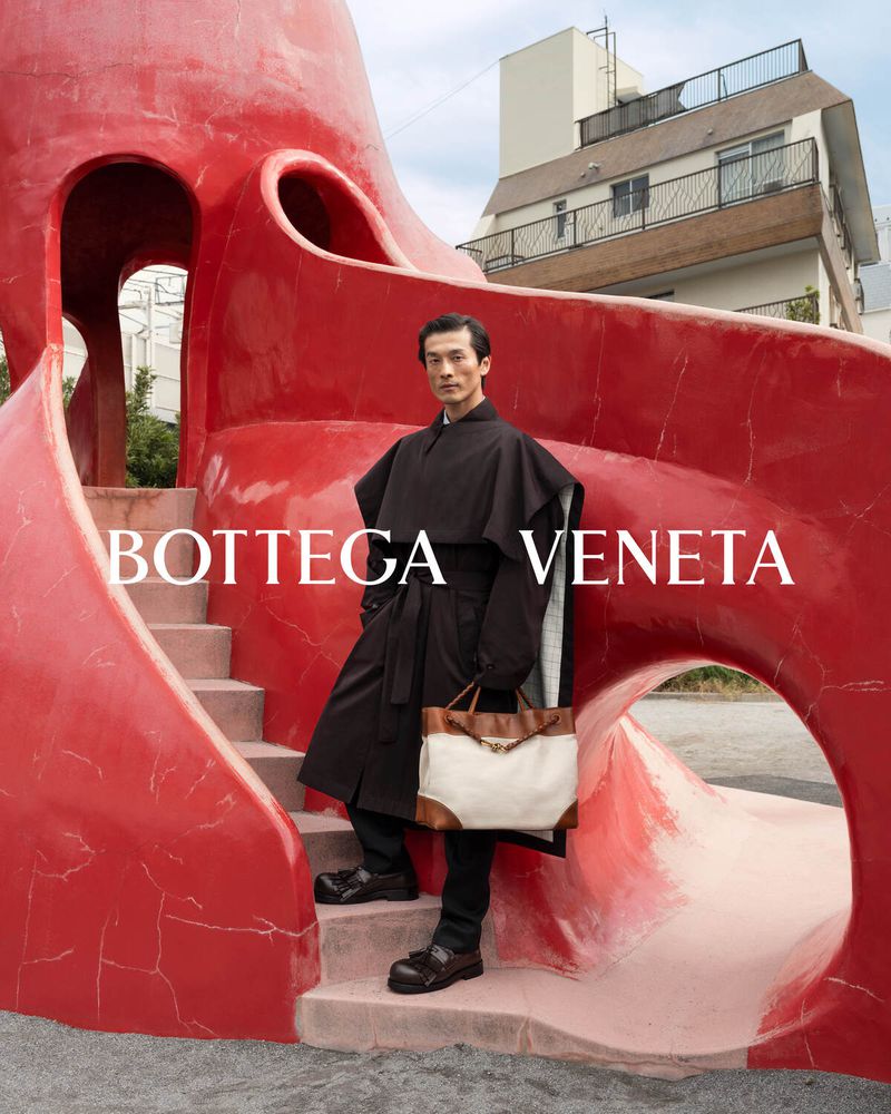 Daisuke Ueda stars in Bottega Veneta's spring-summer 2024 campaign, wearing an oversized coat.