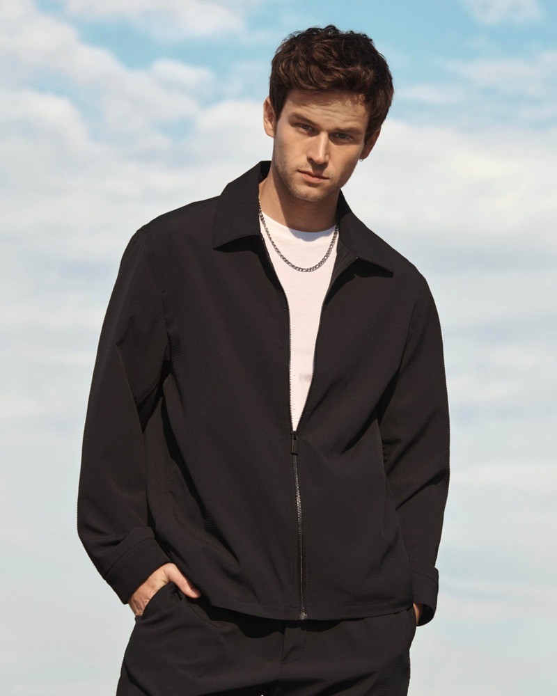 Brandon Flynn exudes effortless charm in a chic Calvin Klein ensemble for the spring 2024 campaign.