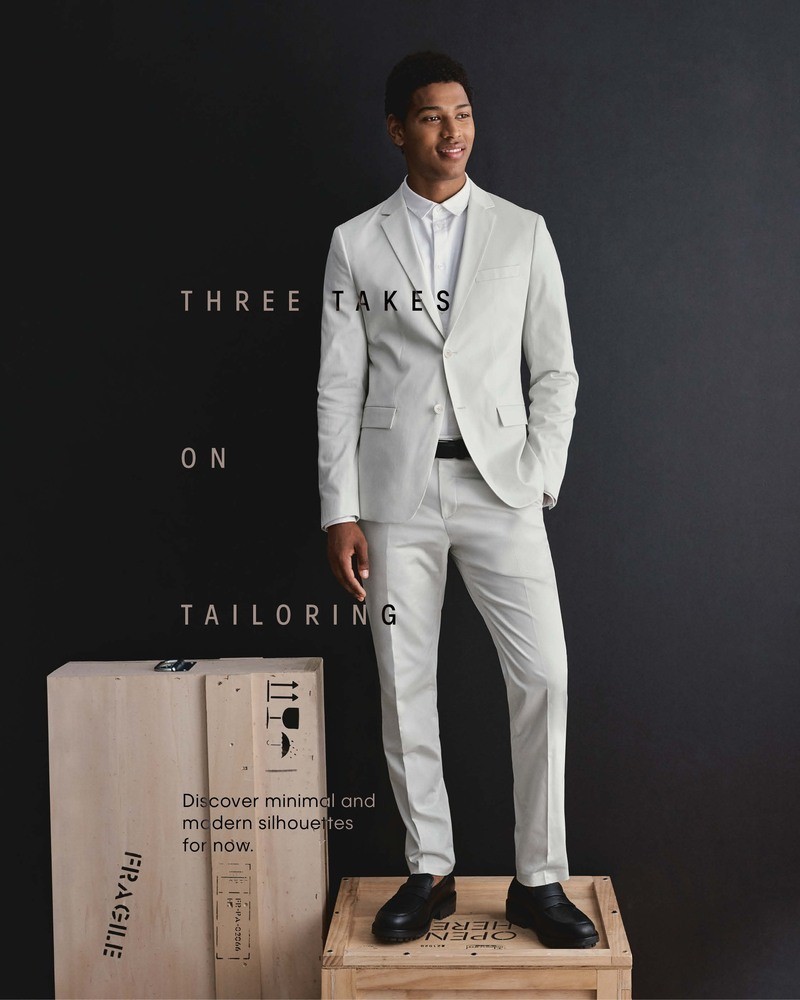 Edmilson Tavares showcases a modern take on minimal tailoring in a sleek suit.
