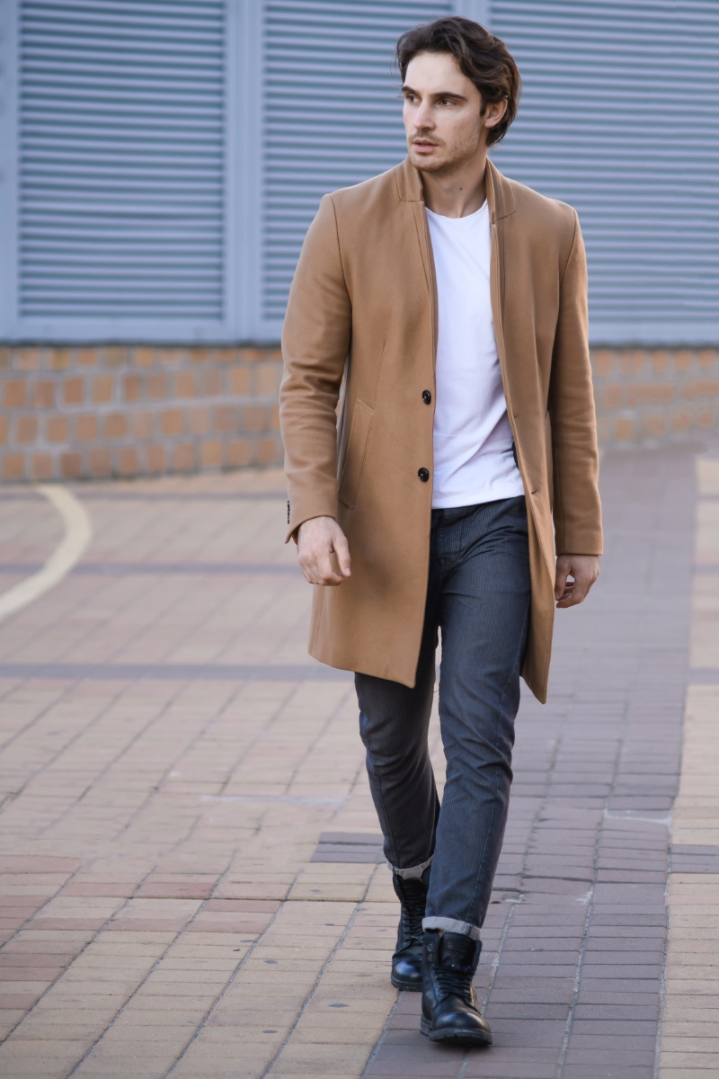 Wardrobe staples like the camel coat remain timeless and ideal for vintage outfits.