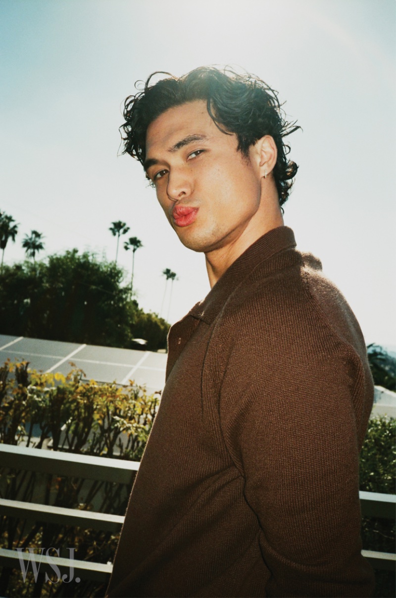 Making a kissy face, Charles Melton poses for a cheeky image for WSJ. Magazine.
