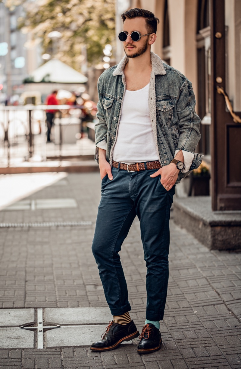 Craft a narrative of cool confidence with a vintage denim jacket, an enduring icon of casual style. Photo: Shutterstock