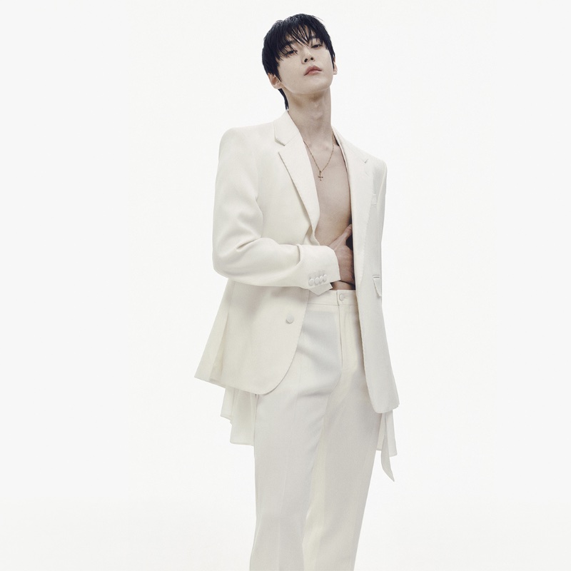 Doyoung wears a chic cream-colored suit for Dolce & Gabbana's spring-summer 2024 advertisement. 