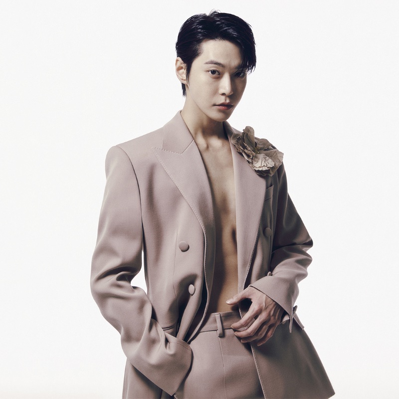 Showcasing masterful tailoring, Doyoung stars in Dolce & Gabbana's spring-summer 2024 ad.
