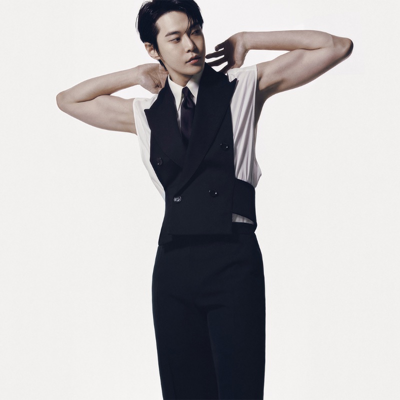 Donning modern tailoring, Doyoung appears in Dolce & Gabbana's spring-summer 2024 campaign.