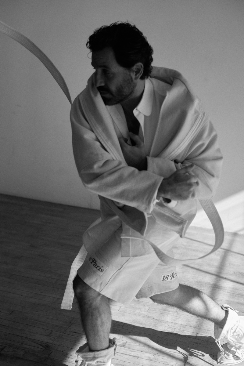 Connecting with Numéro Netherlands, Edgar Ramírez dons a white Kenzo ensemble.