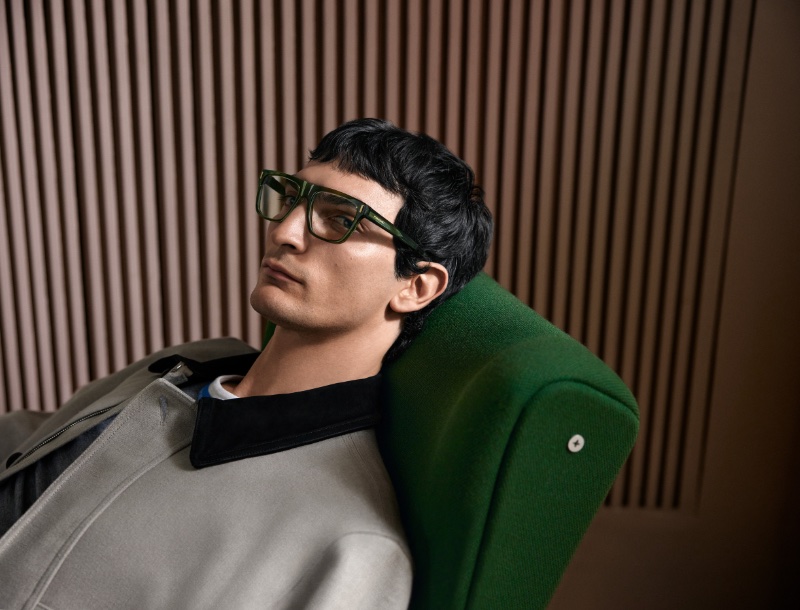 Luca Lemaire dons green framed glasses for Ferragamo's spring-summer 2024 campaign.