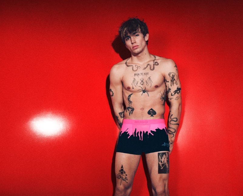 Vinnie Hacker makes a graphic statement in pink and black underwear for the HUGO Bodywear advertisement.