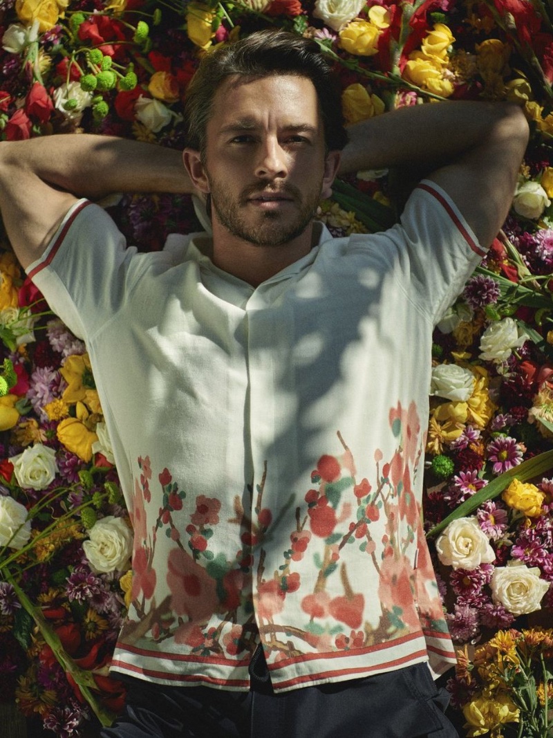 Surrounded by blooms, Jonathan Bailey showcases Orlebar Brown's floral-infused spring attire.