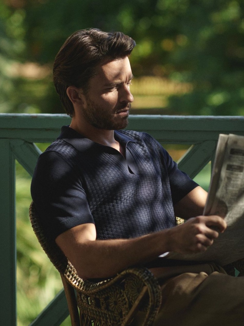 In the serenity of a sunlit read, Jonathan Bailey dons Orlebar Brown's casual attire for spring.