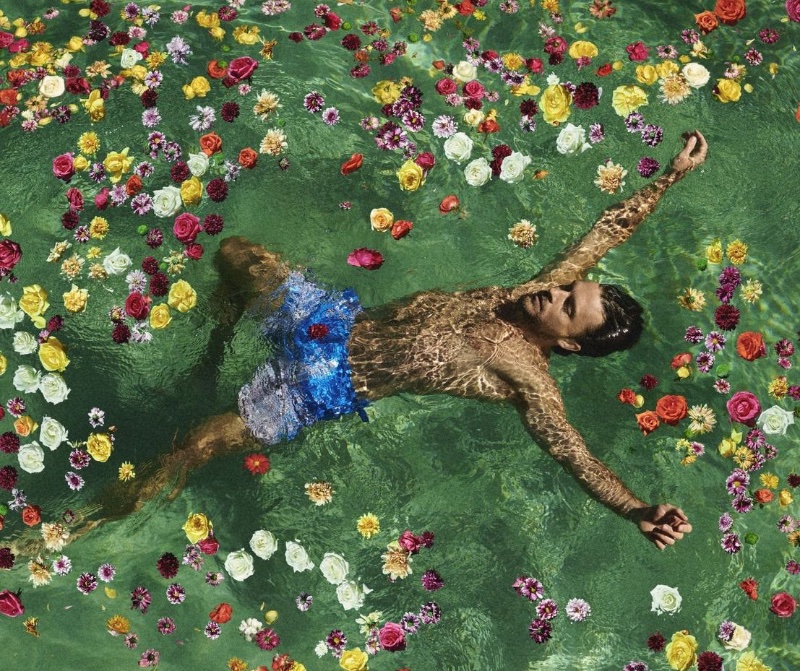 Jonathan Bailey floats amidst a floral tapestry for Orlebar Brown's spring 2024 campaign.