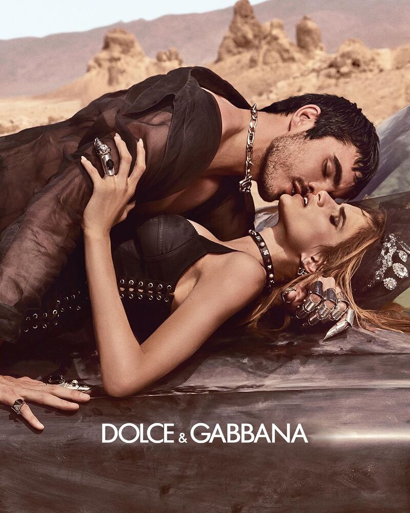 Models Diego Villarreal and Linda Helena embrace in the Dolce & Gabbana Eau de Parfum Intense fragrance advertisement.