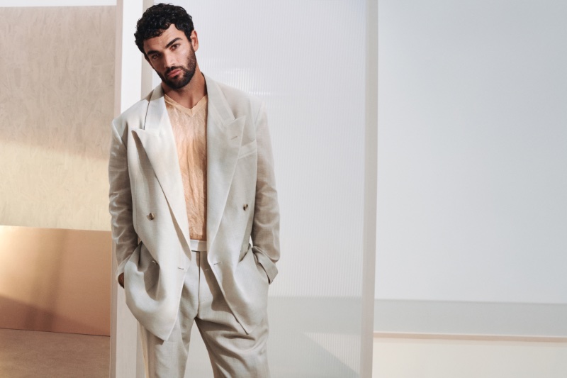 Matteo Berrettini dons a pristine double-breasted jacket for BOSS' spring-summer 2024 campaign.
