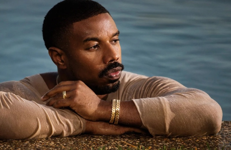 Captured in a pool, Michael B. Jordan wears bracelets and a ring for David Yurman spring 2024 campaign for its Chevron collection. 