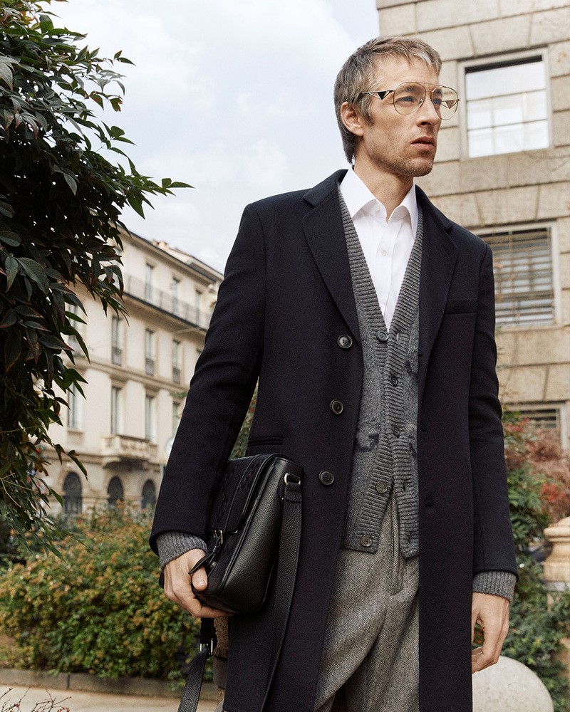 Joel Frampton is a chic vision in a Giorgio Armani overcoat.