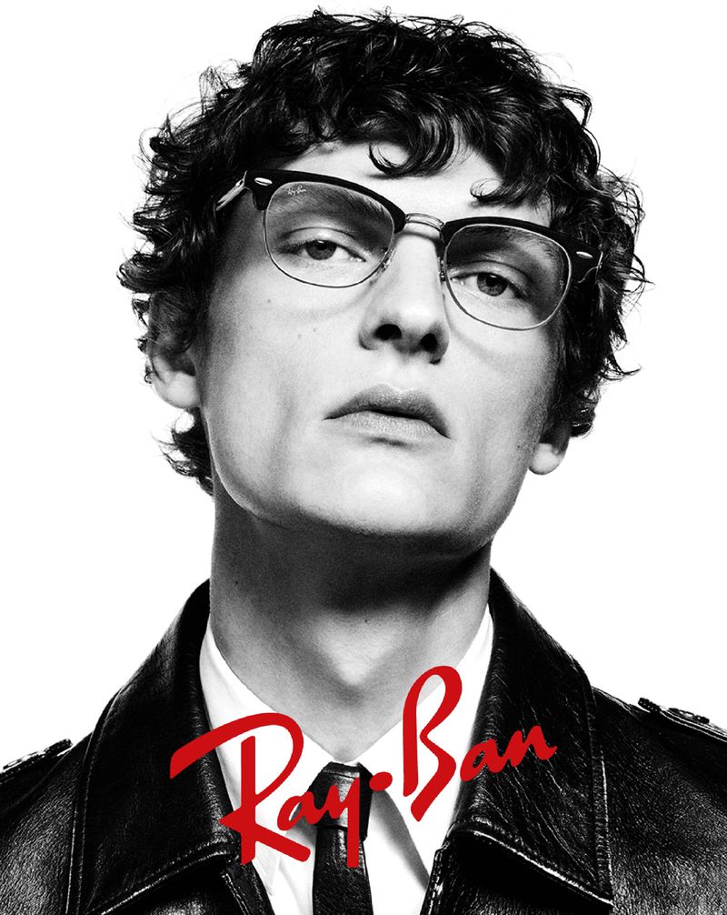 Valentin Caron exudes classic cool in Ray-Ban's black and white advertisement, donning timeless Clubmaster eyeglasses and a leather jacket.