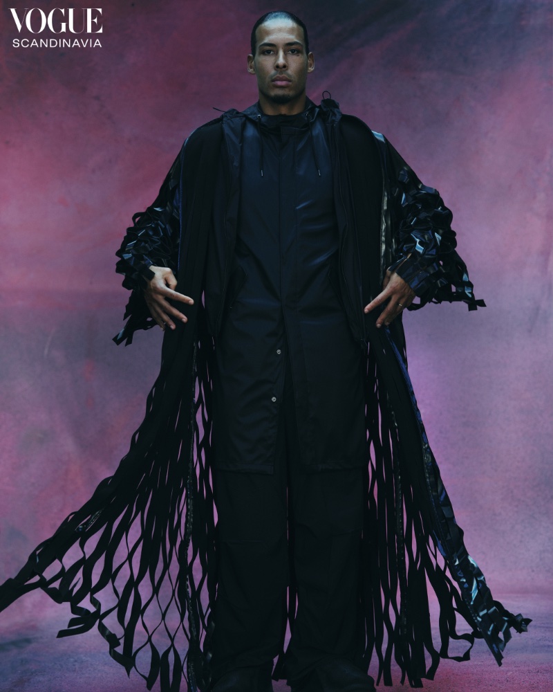 A vision in black, Virgil van Dijk dons a mesh coat and raincoat by Rains for Vogue Scandinavia. 