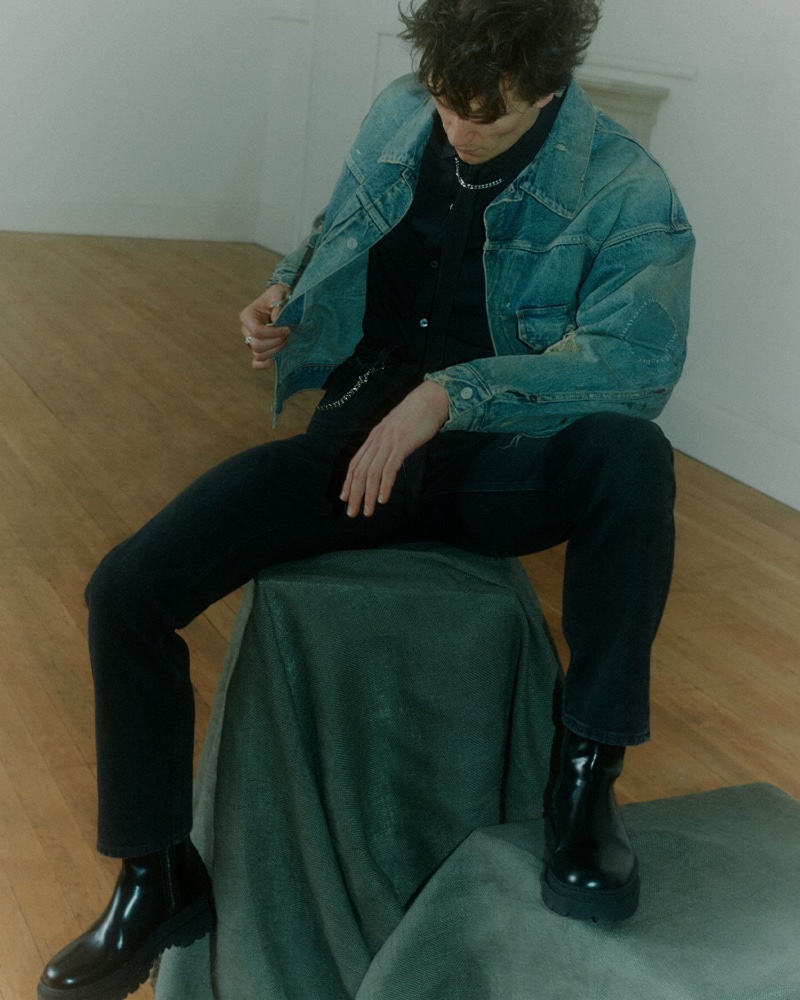 William Bracewell dons a Tom Ford shirt with Loewe jeans and Bottega Veneta boots, finished with a Tom Wood chain necklace and a Saint Laurent denim jacket for Mr Porter.