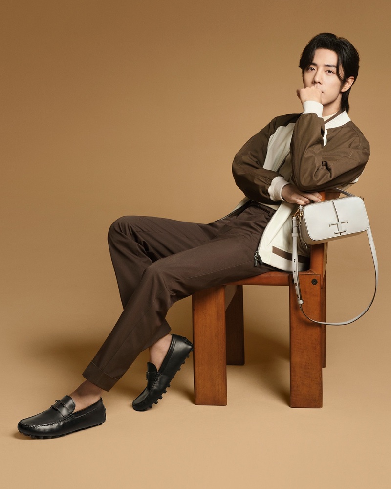 Tod's brand ambassador Xiao Zhan fronts its spring-summer 2024 advertisement.