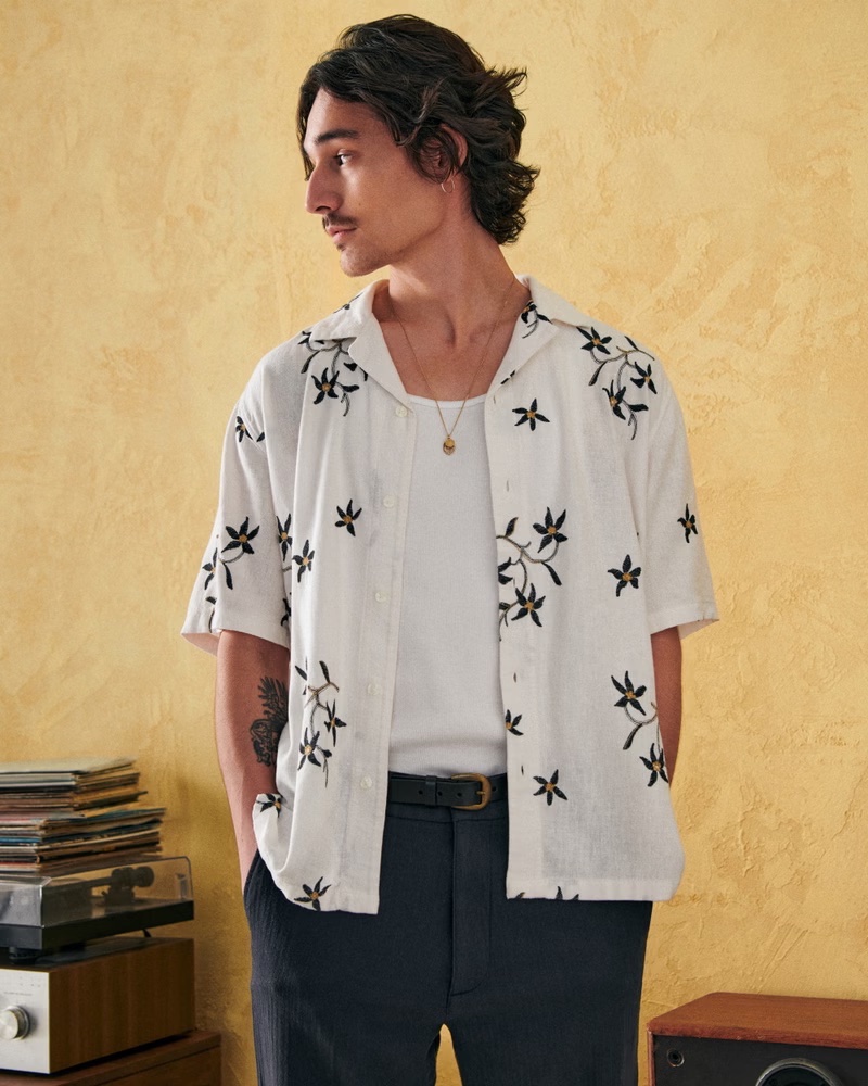 Model Sebastião Hungerbühler sports an Abercrombie & Fitch camp collar summer linen blend embroidered shirt.