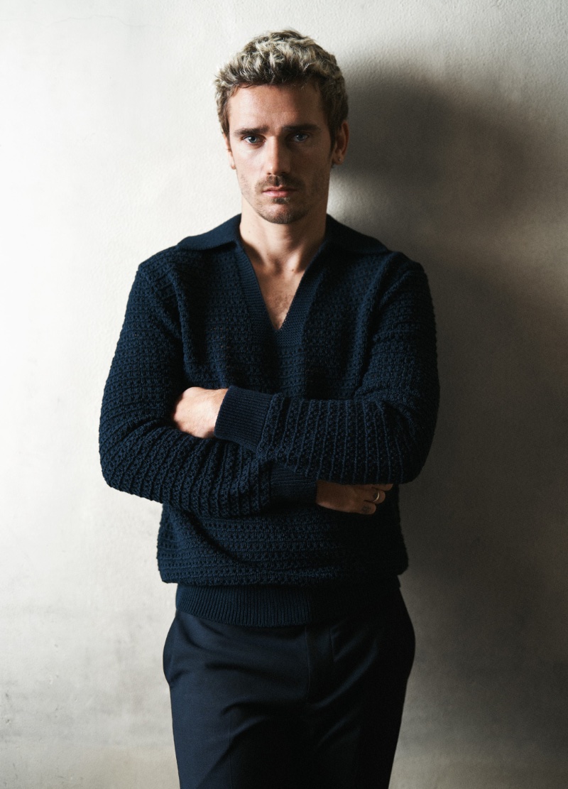 Antoine Griezmann cuts a confident figure in navy knitwear for Mango's spring 2024 campaign.