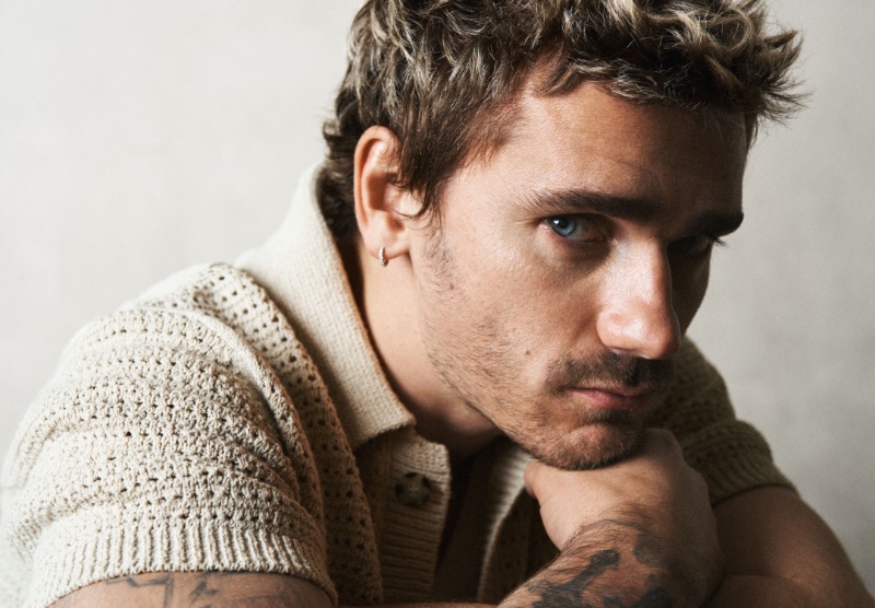 Antoine Griezmann's intense gaze complements a textured short-sleeve knit for Mango's spring 2024 campaign.